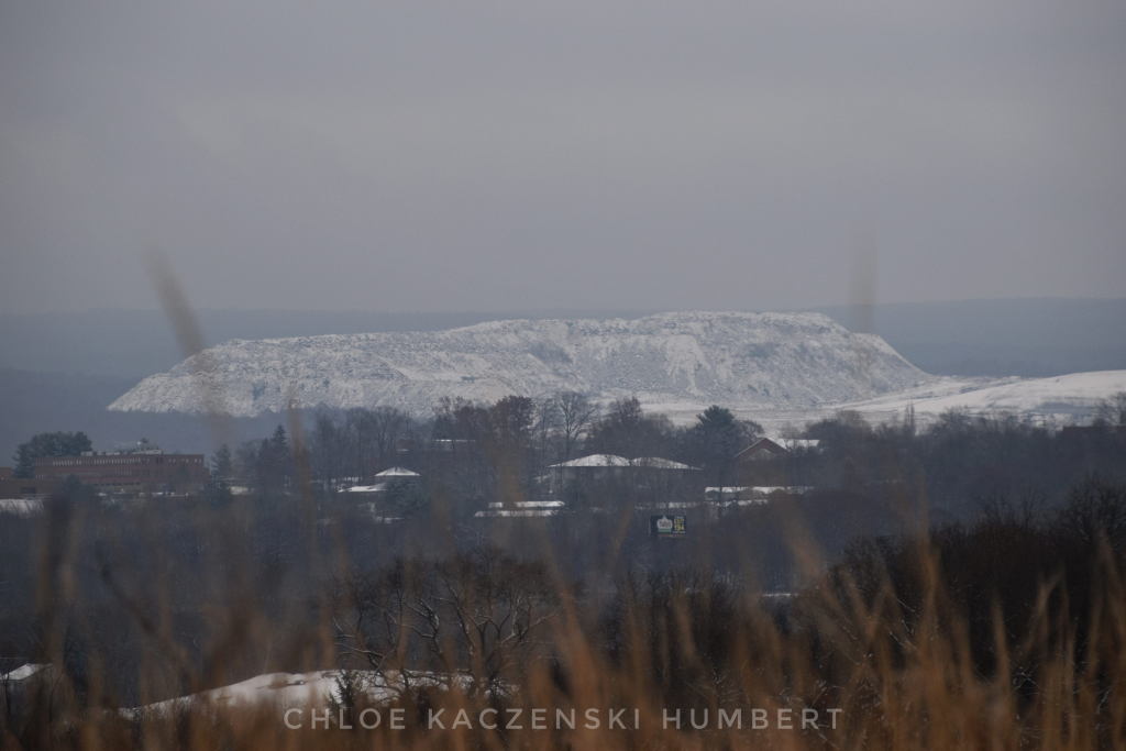 View of the snow covered Keystone Landfill garbage dump mountain in Dunmore seen from across the Lackawanna River valley from Scranton Pennsylvania. Photo by Chloe Kaczenski Humbert. November 28, 2021. 