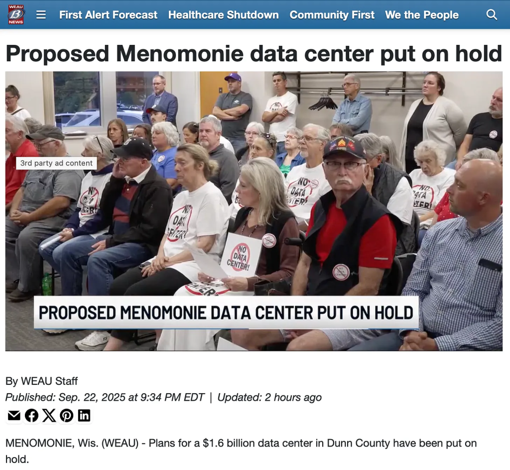 screenshot of tv report from WEAU in Wisconsin showing people with t-shirts, buttons, and signs that read no data center with the red circle and cross symbol over the words.
